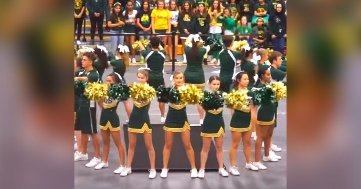 Cheerleaders kick off with an exciting performance that gets